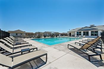 Resort style pool deck with heated spa